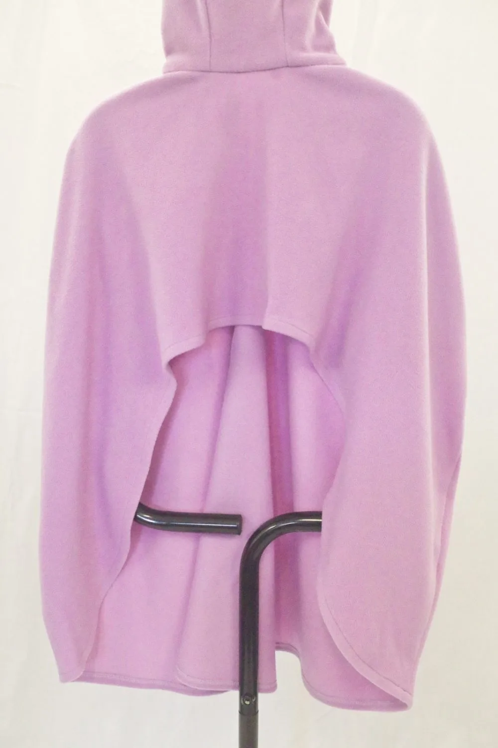 Lilac cape displayed with the hood up showing the horseshoe shape of the cut at the back 